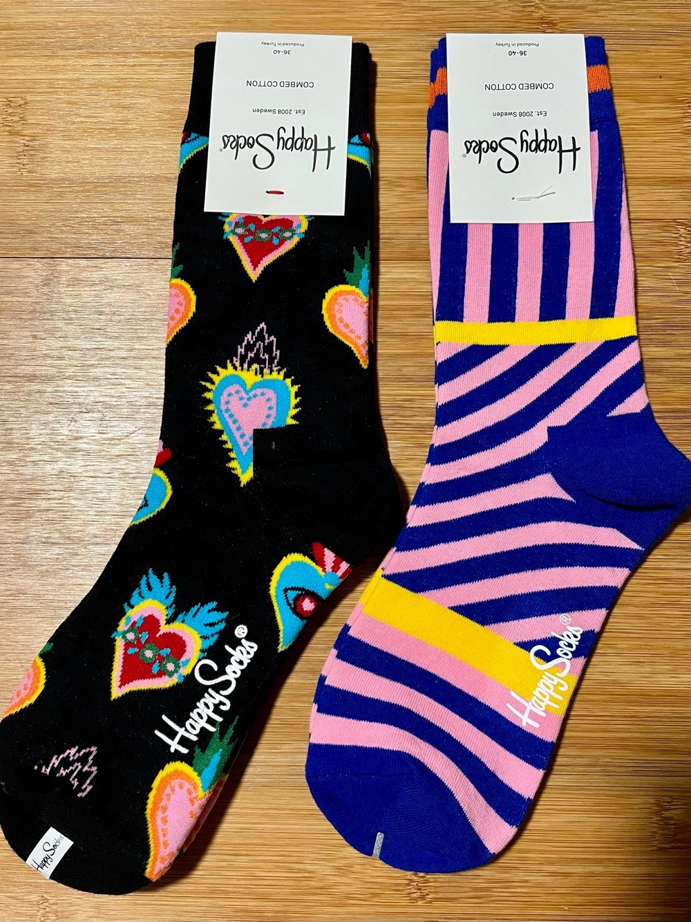 2 Pairs Of Happy Socks Black w/ Colorful Hearts, Pink w/ Blue Stripes Crew Socks